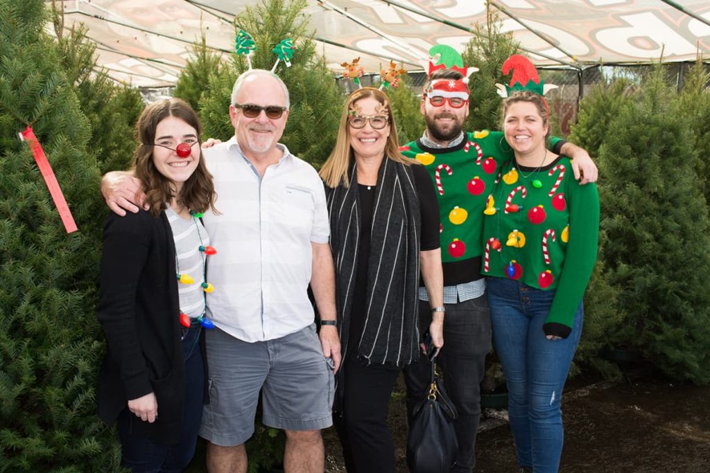 Family shopping at the Santa & Sons Christmas tree lot